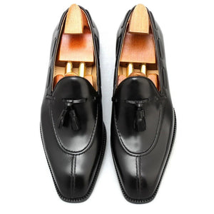 Black High Shine Leather Tassel Loafers, handcrafted with premium leather, featuring elegant tassels and a sleek slip-on design for refined style.