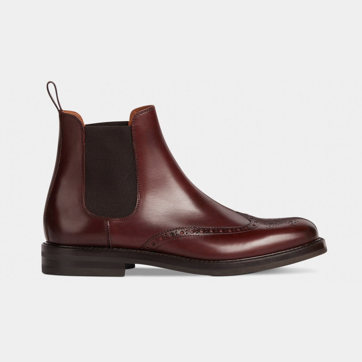 Side view of Brown Leather Brogue Chelsea Boot featuring a brogue pattern and elastic side panels for a sleek, comfortable fit. Premium craftsmanship and timeless design.