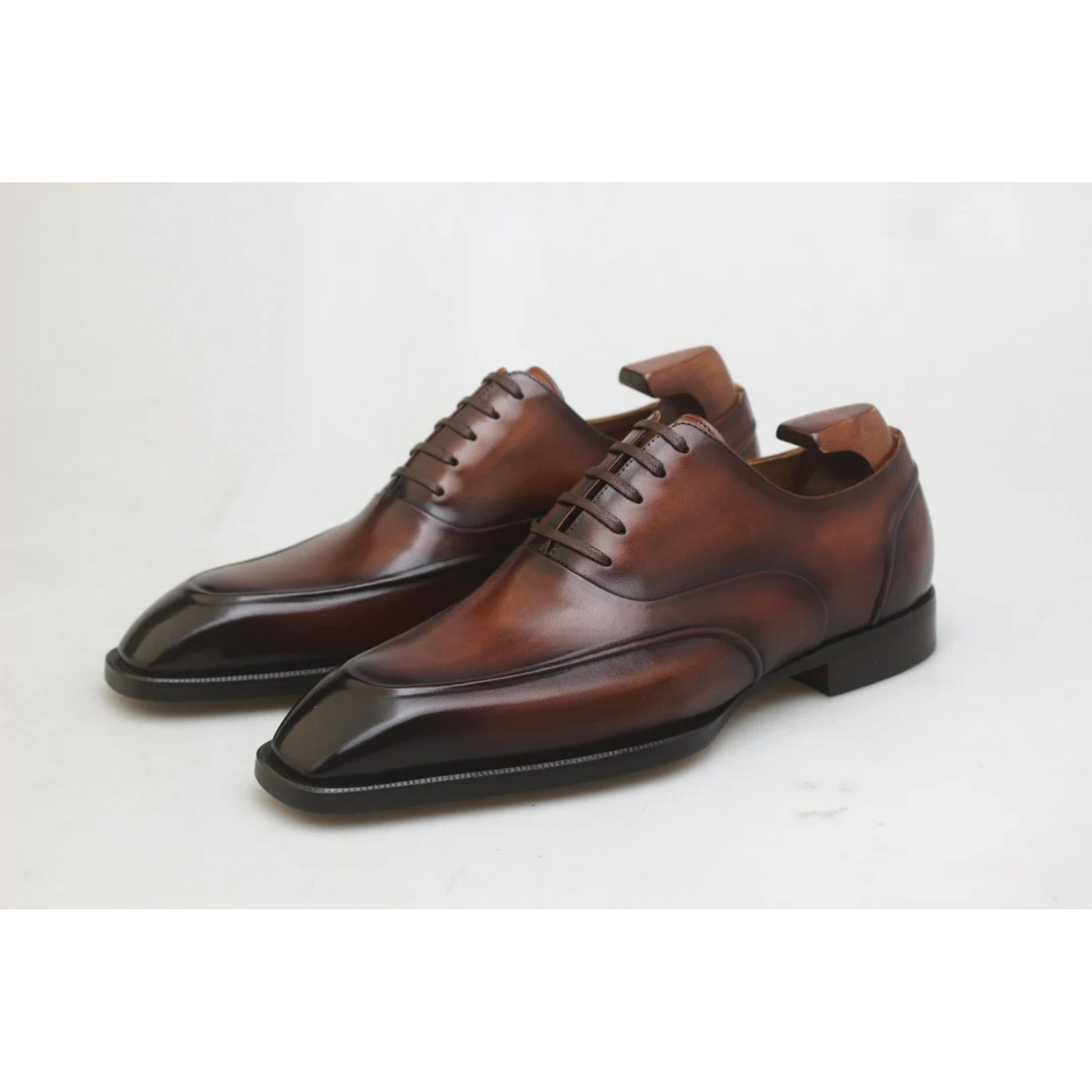 Side view of Hand-Polished Brown Wholecut Oxford Shoes, highlighting the fine patina finish, elegant lace-up design, and smooth leather.