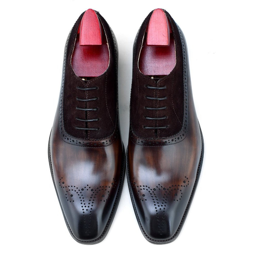 Top view of men’s brown leather oxford shoes with brogue perforations and suede details, perfect for formal events and professional settings.